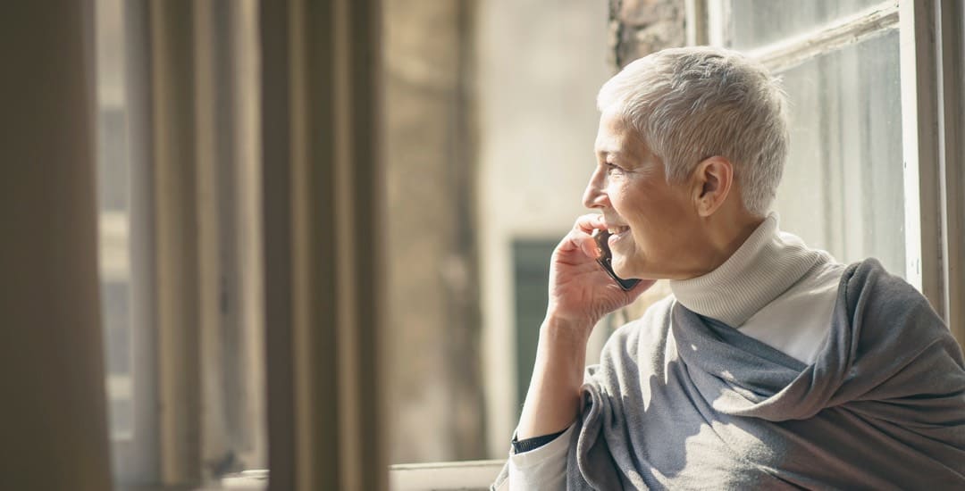 A Brickyard Healthcare resident looks out window